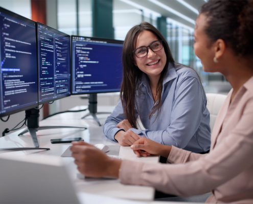 Workers Talking At Computer